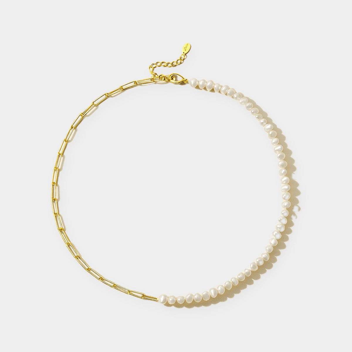 Bracciale e collana a graffetta Rhoni con perla